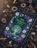 2026 Manifestation Journal with floral design on a dark background with celestial elements.