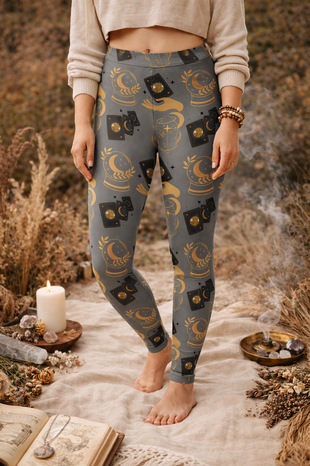 Person wearing patterned leggings standing in a mystical setting with candles and books.
